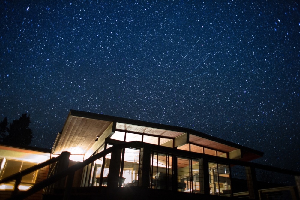 A home beneath a star-filled night sky